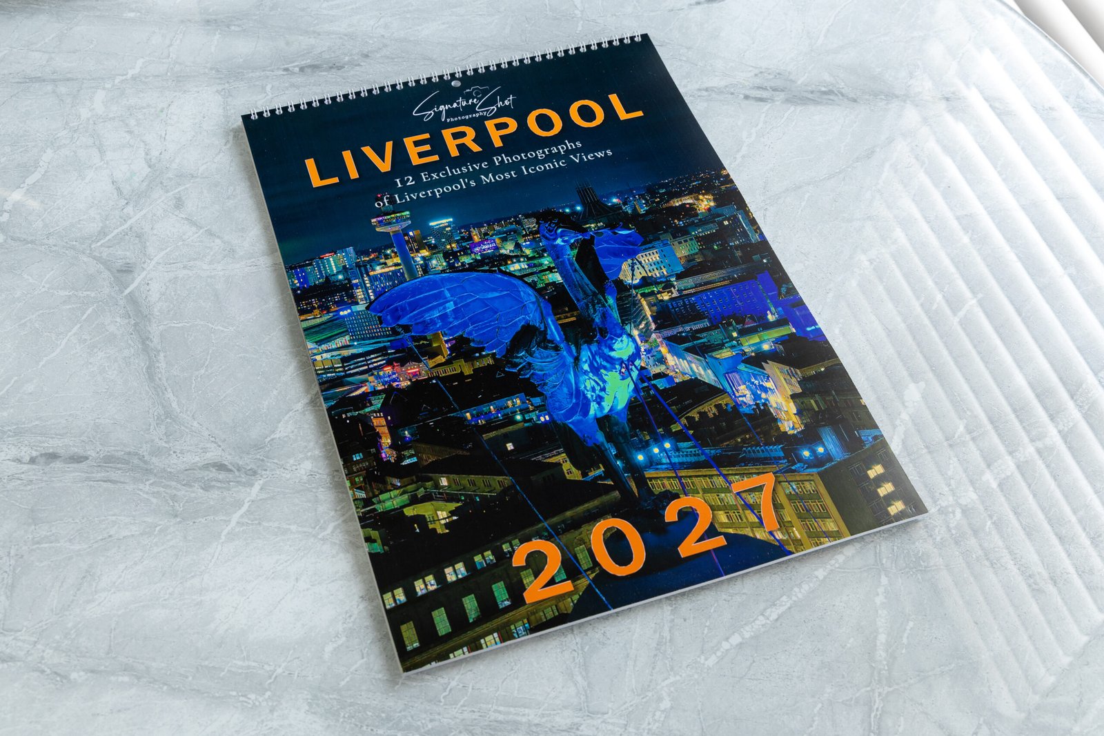 Complete Liverpool 2027 calendar photographed on a premium marble surface