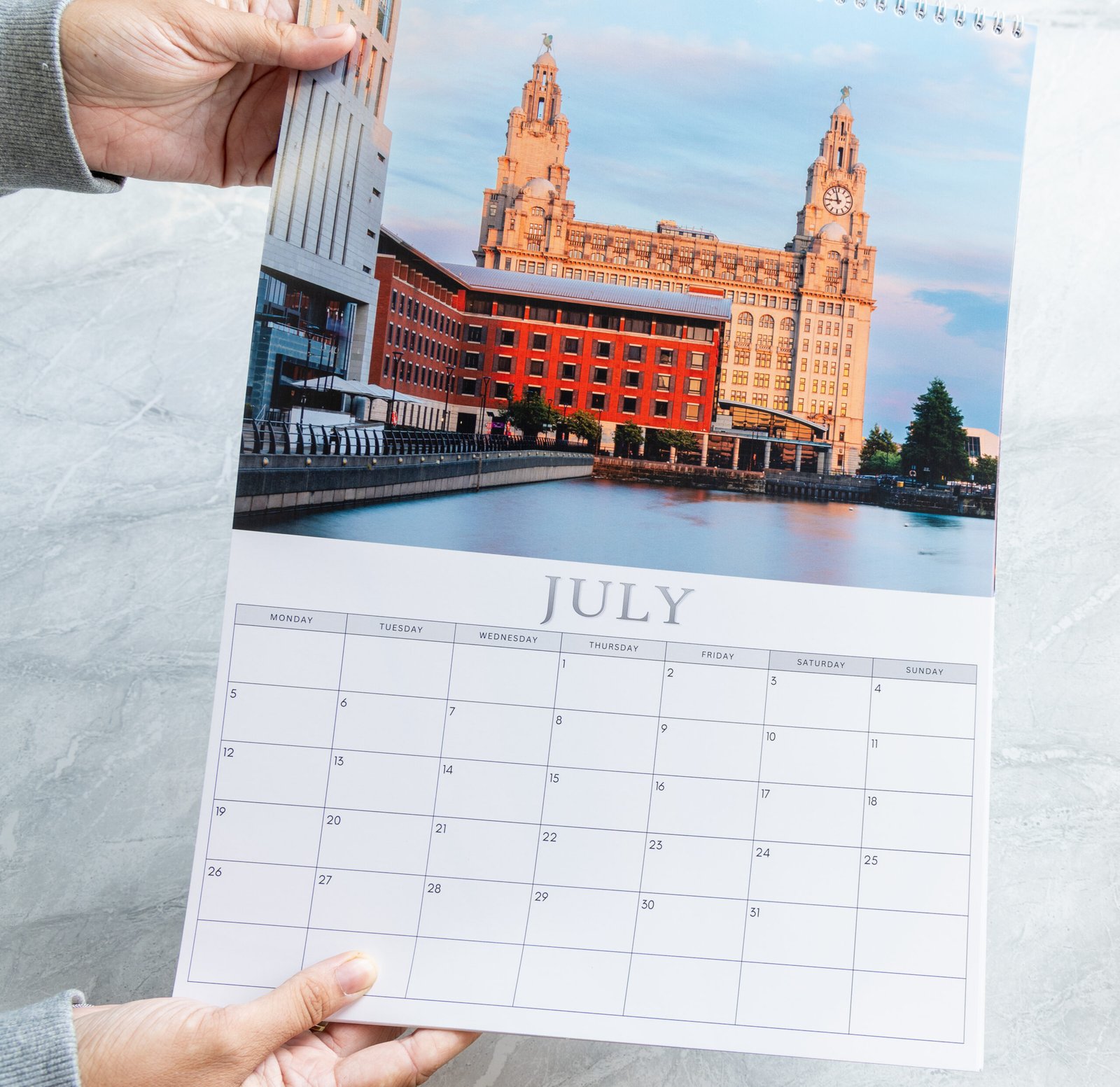 Pages of the Liverpool 2027 calendar being turned