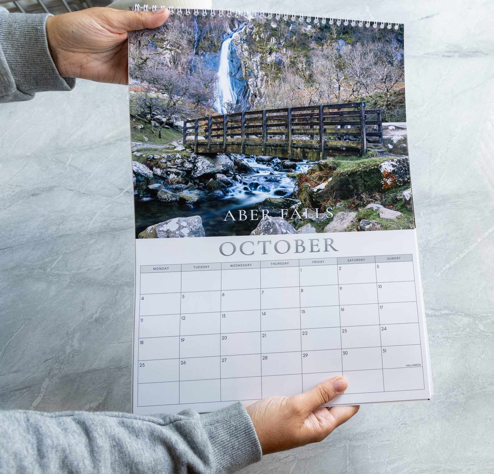 Pages of the North Wales 2027 calendar being turned